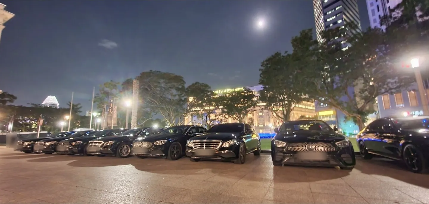 Black Mercedes-Benz E-Class sedans lined up near the Fullerton area at night